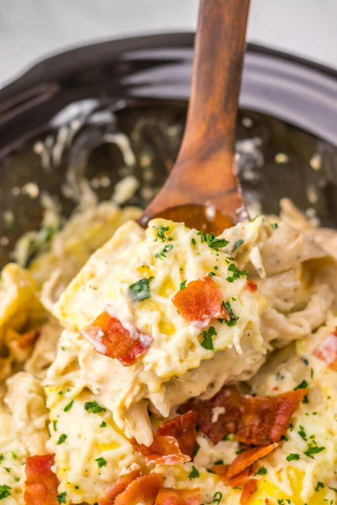 Cheese ravioli coated in rich Alfredo sauce with shredded chicken and bacon.