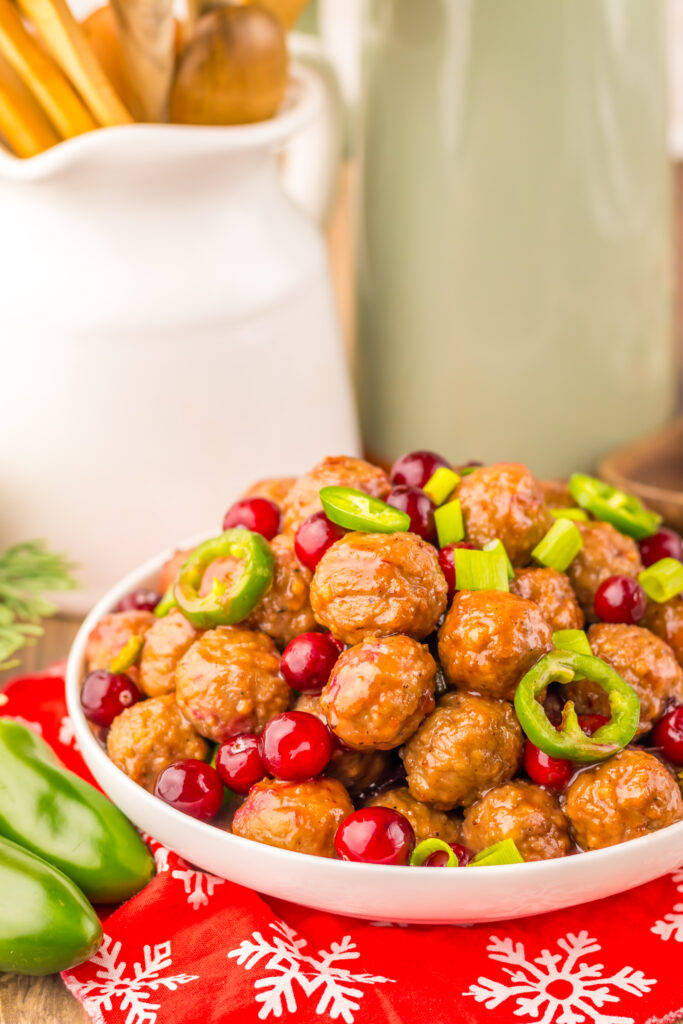 Sweet and spicy Cranberry Jalapeño Meatballs served as an easy Christmas party appetizer.