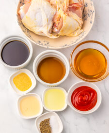 Ingredients for Slow Cooker Honey Bourbon Chicken Thighs including chicken, honey, bourbon, and seasonings.