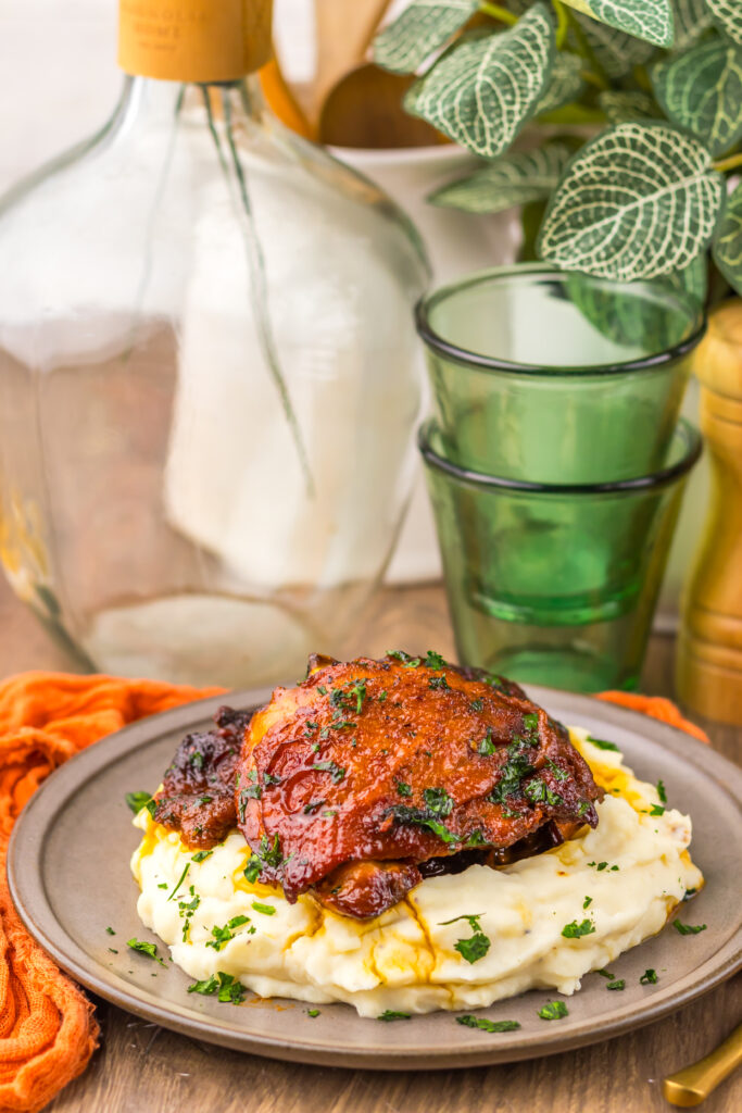 Slow Cooker Honey Bourbon Chicken Thighs served with a rich sweet and savory sauce.