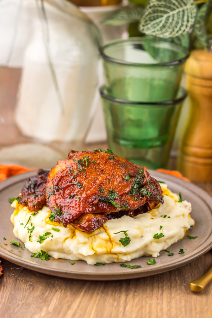 Tender Honey Bourbon Chicken Thighs covered in a glossy bourbon honey sauce.