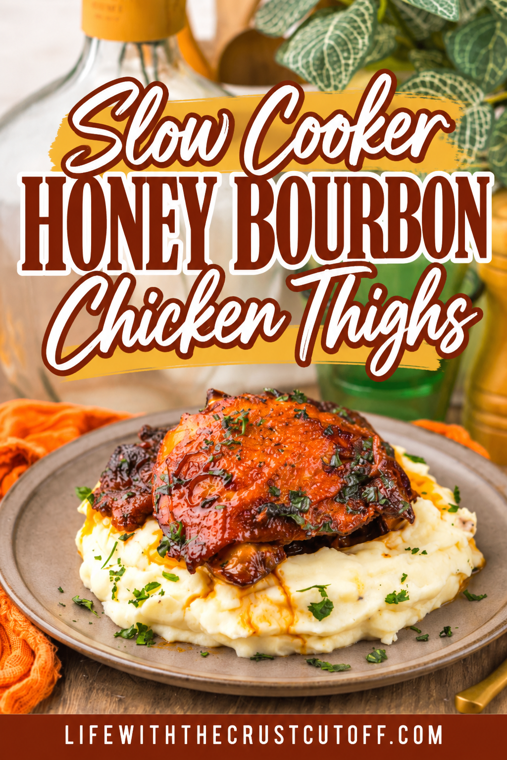 Slow Cooker Honey Bourbon Chicken Thighs served over creamy mashed potatoes and topped with fresh herbs.